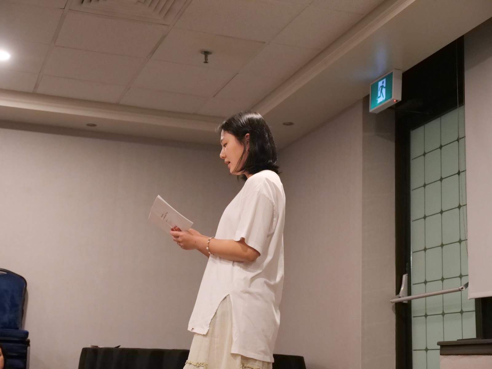 Students begin the open mic, and FutureVerser Eunsae Lee reads an original poem.