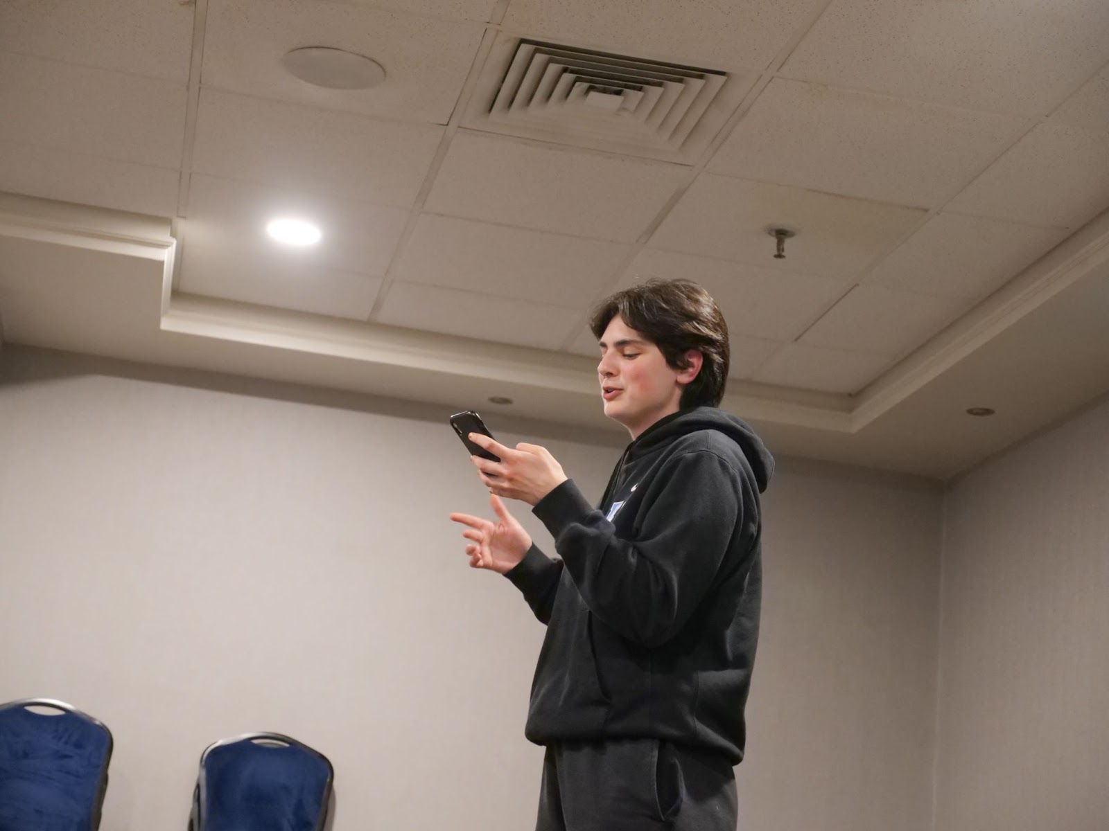 Finalist Chloé Simard reads a poem. The students take turns reading and reciting poetry in their pajamas, late into the night.