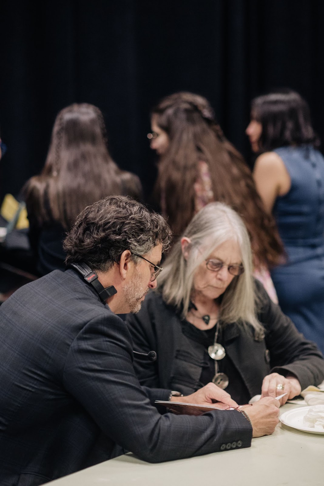 While Executive Director David Smith, and English Judge Susan Musgrave talk business.