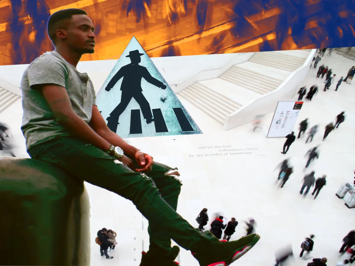 a man sitting in a busy traffic area