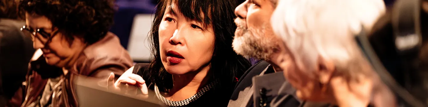 Judges talking in front of computer