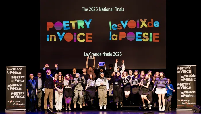 Students jumping on a stage