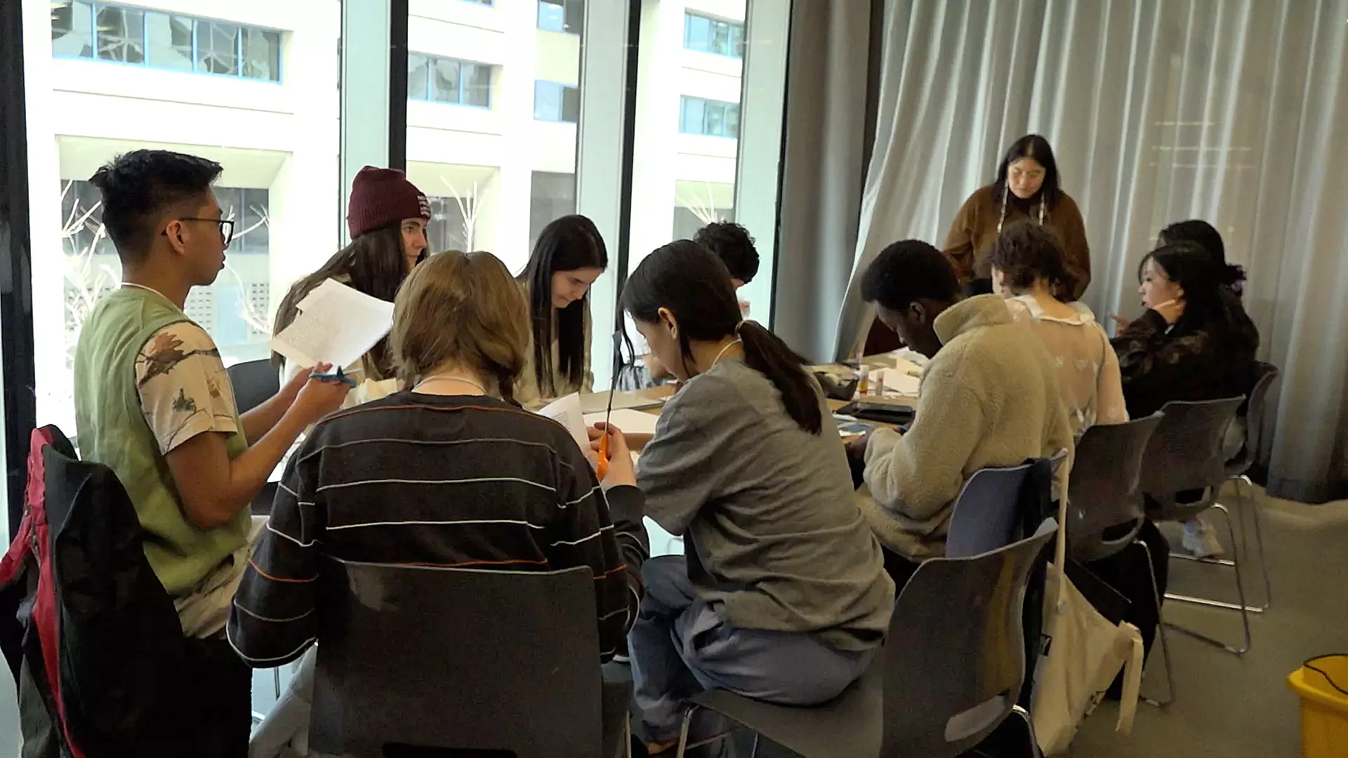 Students cut poetry lines of their own to create a cut-up poem.