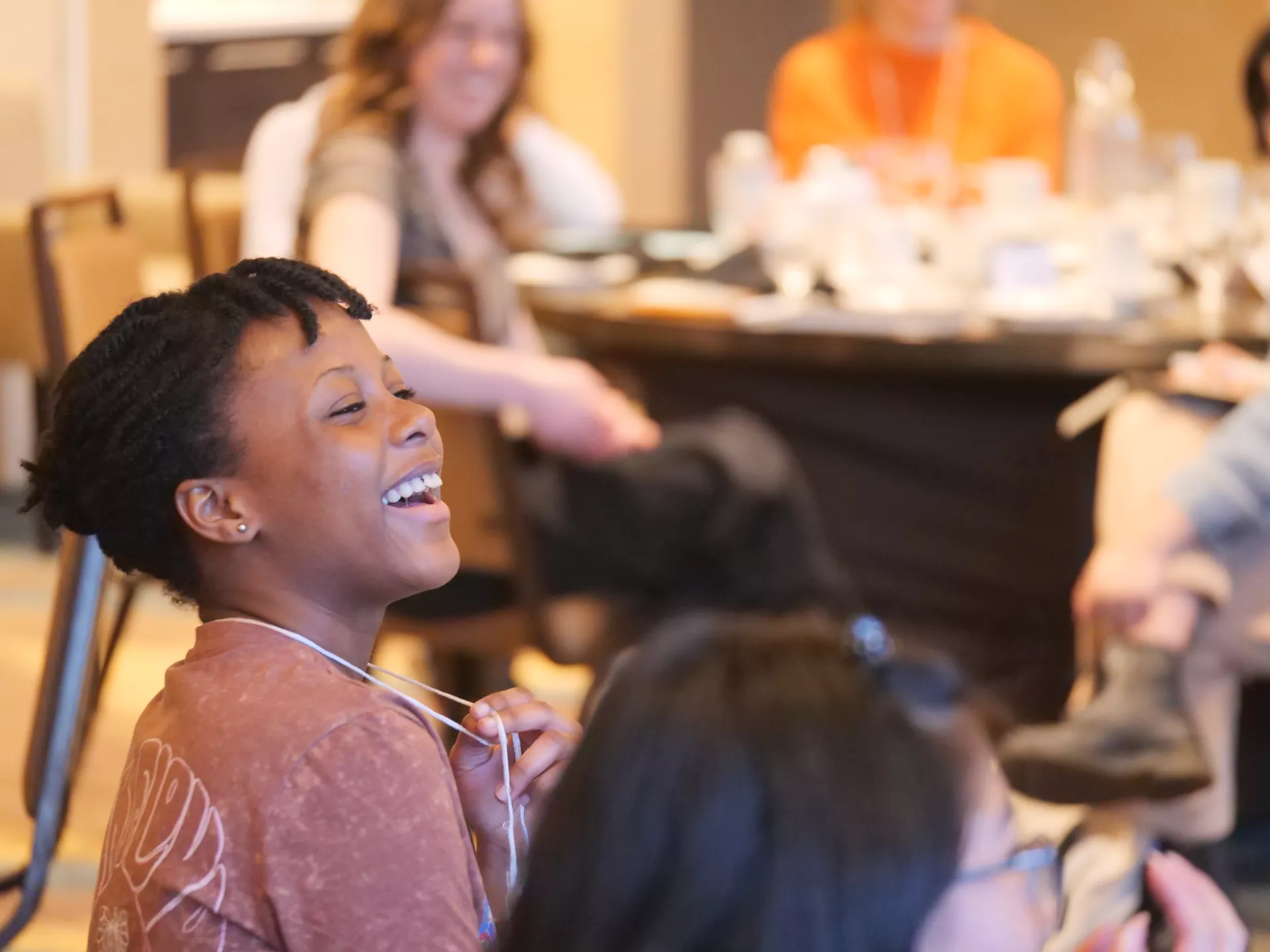 National Finalist Hope Anaky shares a laugh at the Bad Poems Writing Exercise.