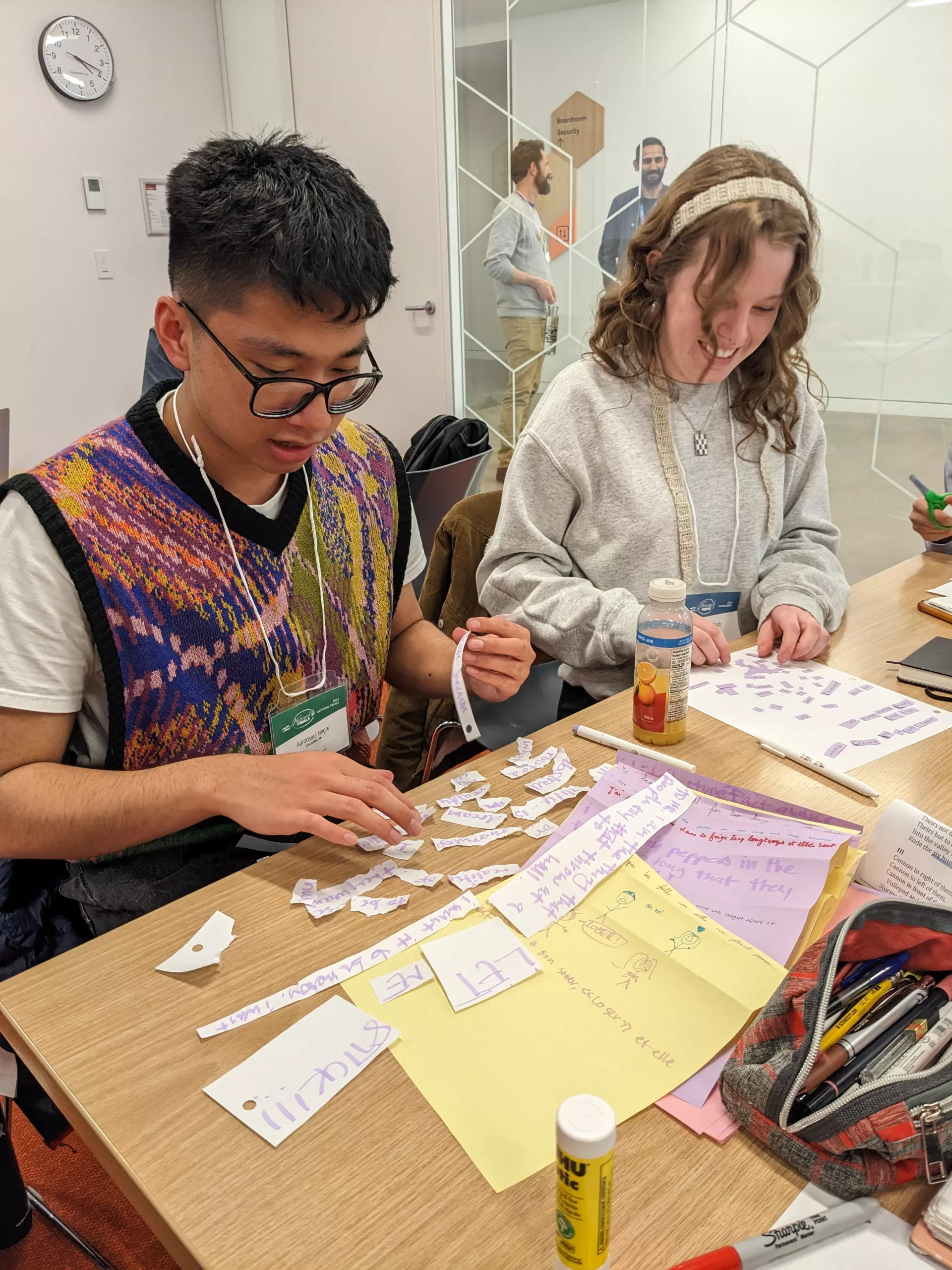 National Finalist Aaronsaul Negre and FutureVerser Ella Bachrach reconstruct poems from pieces.