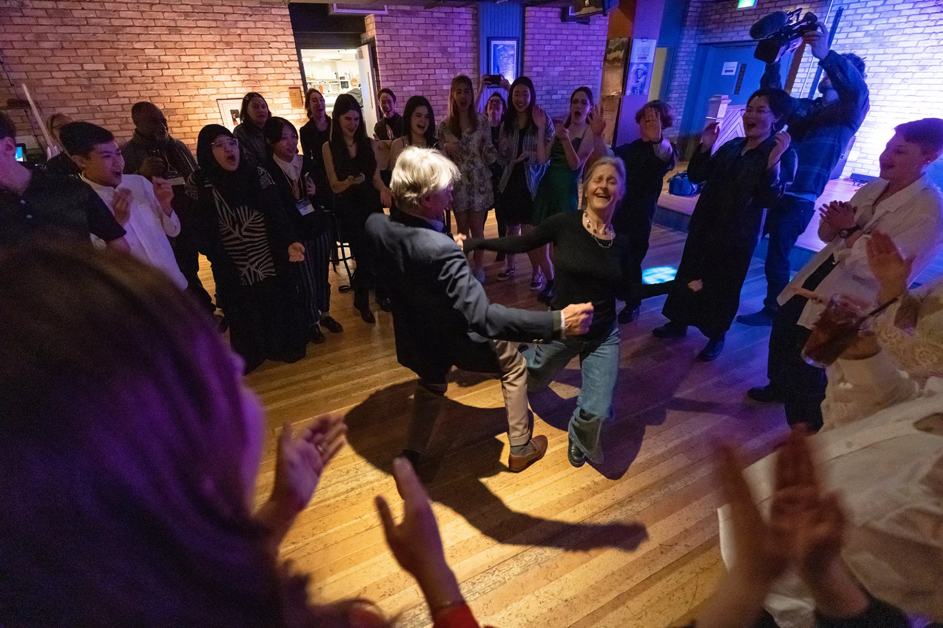 Founder Scott Griffin shows the students how it's done with Tessa Griffin.