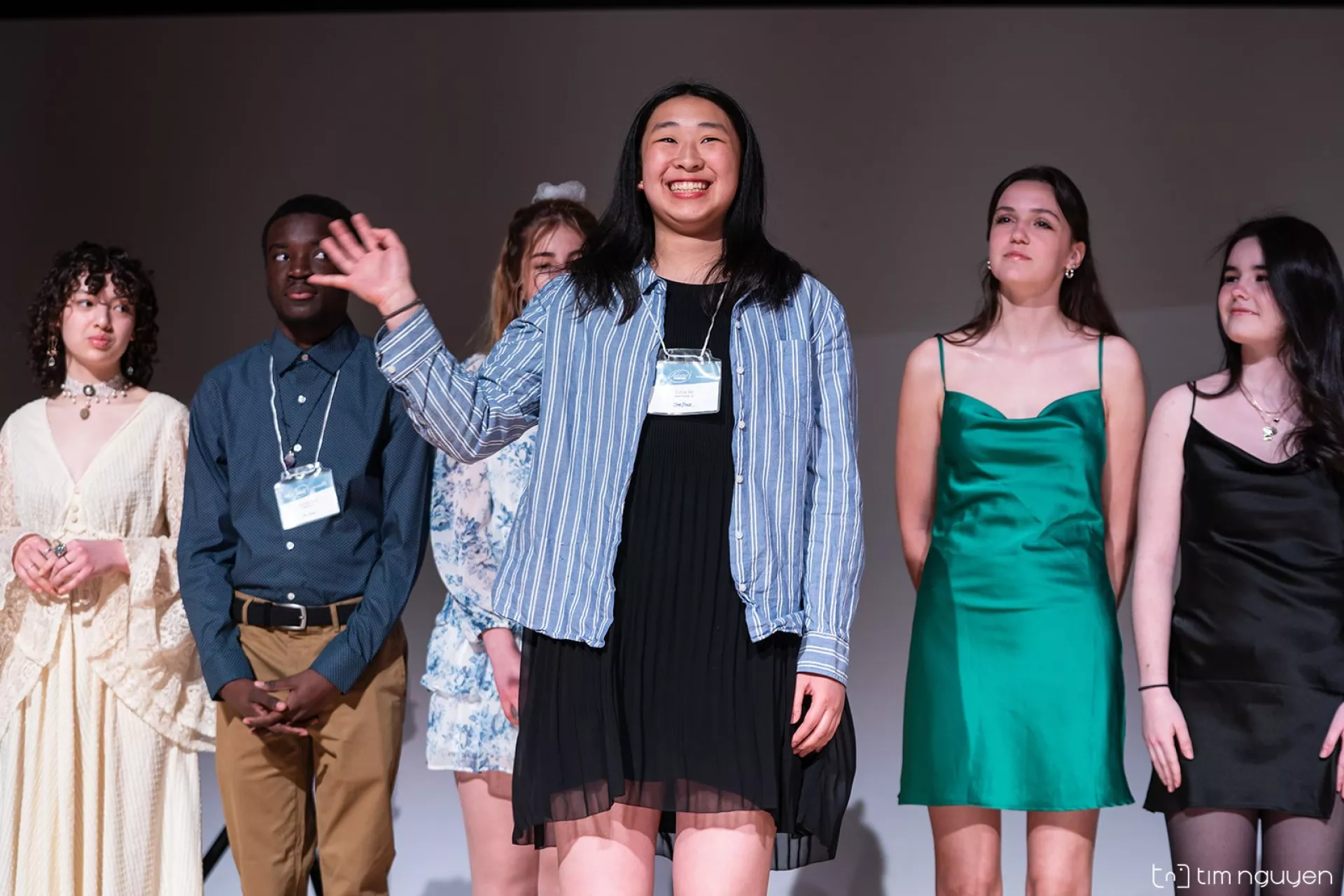 The FutureVersers take the stage and greet the audience at National Finals. An enthusiastic Jamie He waves back to the crowd.