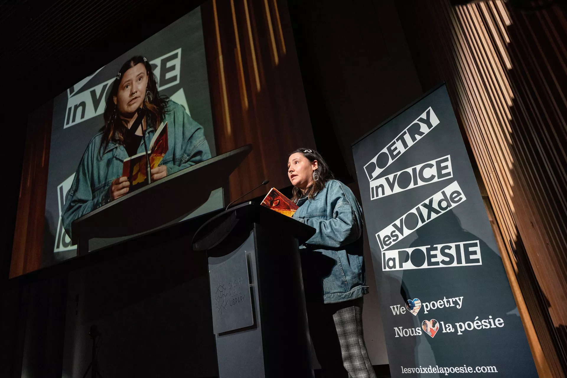 Indigenous poet Kaitlyn Purcell reads a poem during the National Finals.